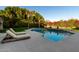 Inviting pool with lounge chairs and expansive patio at 9053 N 46Th St, Phoenix, AZ 85028