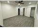 Cozy bedroom with a ceiling fan and closet at 102 W Maryland Ave # F1, Phoenix, AZ 85013