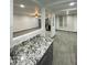 Granite countertop in an open kitchen with sightlines to the living space at 102 W Maryland Ave # F1, Phoenix, AZ 85013
