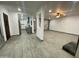 View of the open-concept living area with a kitchen and fireplace at 102 W Maryland Ave # F1, Phoenix, AZ 85013