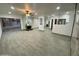 Bright living room with an adjacent patio and sleek fireplace at 102 W Maryland Ave # F1, Phoenix, AZ 85013