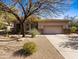 Inviting single-story home featuring a well-kept desert landscape and a neutral color palette at 12889 N 145Th Way, Scottsdale, AZ 85259