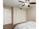 Bright bedroom featuring a large closet and ceiling fan at 1628 E Kent Ave, Chandler, AZ 85225