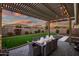 Outdoor patio with seating and pergola, perfect for dining at 210 E Balao Dr, Phoenix, AZ 85085