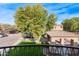 View from balcony overlooking community amenities and parking at 21655 N 36Th Ave # 117, Glendale, AZ 85308