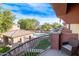 Balcony view of community pool and surrounding landscape at 21655 N 36Th Ave # 117, Glendale, AZ 85308