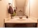 Modern bathroom with a single vanity, dark wood cabinets and a clean design at 21655 N 36Th Ave # 117, Glendale, AZ 85308