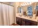 Bathroom with double vanity and large mirror at 21655 N 36Th Ave # 117, Glendale, AZ 85308