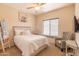 Bedroom with a double bed, chair, and window with blinds at 21655 N 36Th Ave # 117, Glendale, AZ 85308