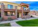 Two-story townhome with Spanish-style architecture and a two-car garage at 21655 N 36Th Ave # 117, Glendale, AZ 85308
