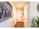 Bright hallway with hardwood floors, white doors and a modern decor at 21655 N 36Th Ave # 117, Glendale, AZ 85308