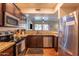 Modern kitchen with stainless steel appliances and granite countertops at 21655 N 36Th Ave # 117, Glendale, AZ 85308