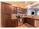 Modern kitchen with stainless steel appliances and granite countertops at 21655 N 36Th Ave # 117, Glendale, AZ 85308