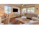 Living room with comfortable couch and large TV at 21655 N 36Th Ave # 117, Glendale, AZ 85308
