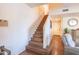 Modern staircase leading to upper level of the townhome at 21655 N 36Th Ave # 117, Glendale, AZ 85308