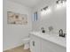 Bathroom featuring double sinks, sleek fixtures, and modern lighting at 2364 W Emelita Ave, Mesa, AZ 85202