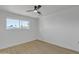 Bright bedroom with a ceiling fan and a large window offering plenty of natural light at 2364 W Emelita Ave, Mesa, AZ 85202