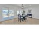 View of the dining room. Shows flooring, fixtures and furniture as well as sliding glass door at 2364 W Emelita Ave, Mesa, AZ 85202