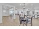 Open concept view of the dining and living room. Shows flooring, fixtures and furniture at 2364 W Emelita Ave, Mesa, AZ 85202
