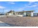 View of exterior with black and white color scheme with desert landscaping and freshly painted exterior at 2364 W Emelita Ave, Mesa, AZ 85202