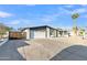 Expansive driveway leading to a 2 car garage and freshly painted exterior with desert landscaping at 2364 W Emelita Ave, Mesa, AZ 85202