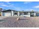 Charming single story home with gravel yard, two car garage and freshly painted white exterior at 2364 W Emelita Ave, Mesa, AZ 85202