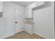Bright hallway with storage cabinets and a white door at 2364 W Emelita Ave, Mesa, AZ 85202
