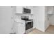 All white kitchen with new appliances including range and microwave oven at 2364 W Emelita Ave, Mesa, AZ 85202