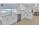 Modern kitchen featuring white cabinets, stainless steel appliances, and quartz countertops at 2364 W Emelita Ave, Mesa, AZ 85202