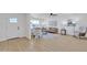 Open concept view of the living room. Shows flooring, fixtures, furniture, and front door at 2364 W Emelita Ave, Mesa, AZ 85202