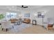 Open concept view of the living room. Shows flooring, fixtures and furniture at 2364 W Emelita Ave, Mesa, AZ 85202