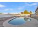 A beautiful swimming pool with a concrete border and rock landscaping around the perimeter at 2364 W Emelita Ave, Mesa, AZ 85202
