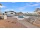 A backyard view of a pool with rock features and a stone walkway at 2364 W Emelita Ave, Mesa, AZ 85202