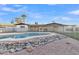 View of the in-ground pool area, featuring rock details and secure fencing at 2364 W Emelita Ave, Mesa, AZ 85202