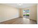 Simple bedroom with a sliding door leading to the backyard at 2610 E Contessa St, Mesa, AZ 85213