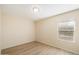 Empty bedroom featuring a window with blinds at 2610 E Contessa St, Mesa, AZ 85213