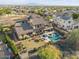 An expansive home with a pool, spa, and mountain backdrop at 3428 N Park St, Buckeye, AZ 85396