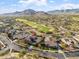 Aerial view of house, golf course, and mountain views at 3428 N Park St, Buckeye, AZ 85396