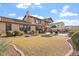 Landscaped backyard with lush lawn and a partial view of the pool at 3428 N Park St, Buckeye, AZ 85396