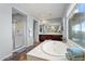 Elegant bathroom featuring a soaking tub and walk-in shower at 3428 N Park St, Buckeye, AZ 85396
