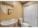 Powder room with pedestal sink and updated fixtures at 3428 N Park St, Buckeye, AZ 85396