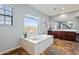 Luxurious bathroom with soaking tub and double vanity at 3428 N Park St, Buckeye, AZ 85396
