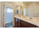 Bathroom with double sinks and a shower/tub combo at 3428 N Park St, Buckeye, AZ 85396