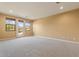 Bright bedroom with carpeted floors and access to backyard at 3428 N Park St, Buckeye, AZ 85396