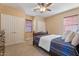 Bright bedroom with double closets and neutral decor at 3428 N Park St, Buckeye, AZ 85396