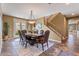 Elegant dining room with a large table and access to the backyard at 3428 N Park St, Buckeye, AZ 85396