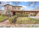 A charming two-story house with stone accents and a well-manicured lawn at 3428 N Park St, Buckeye, AZ 85396