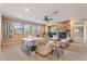 Spacious living room features a stone fireplace and ample natural light at 3428 N Park St, Buckeye, AZ 85396