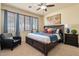 Large main bedroom with plush carpet and window seating at 3428 N Park St, Buckeye, AZ 85396
