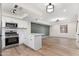 Open concept kitchen with white cabinets and island at 6152 W Townley Ave, Glendale, AZ 85302